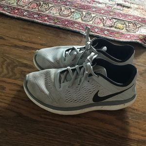 Grey Nike tennis shoes